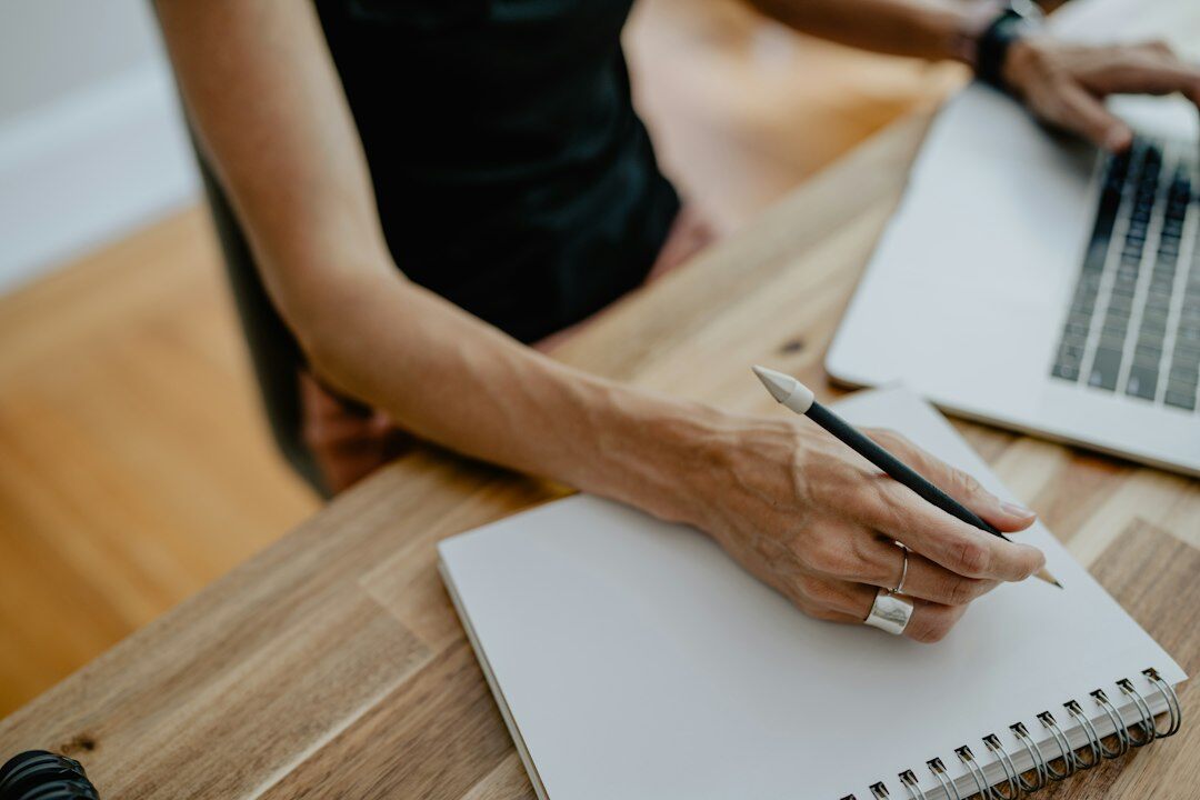 writer at desk with notebook