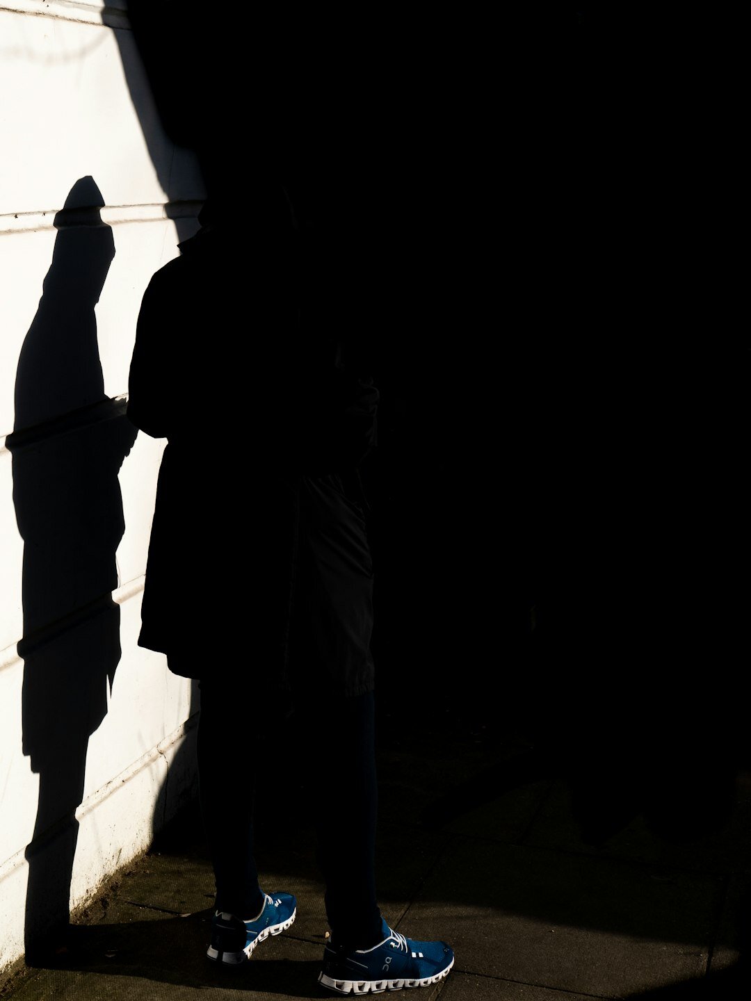 two people arguing in shadows