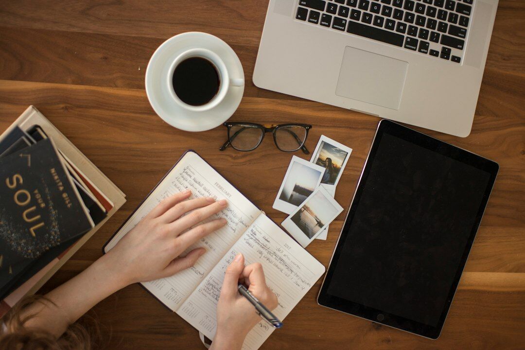 writer at desk with notes